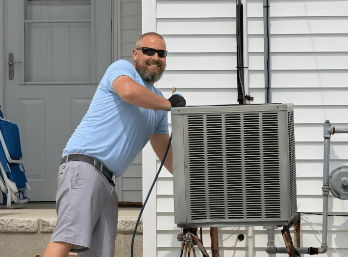 Conlow Heating & Cooling technician servicing an outdoor AC condenser unit at a Cape May County home